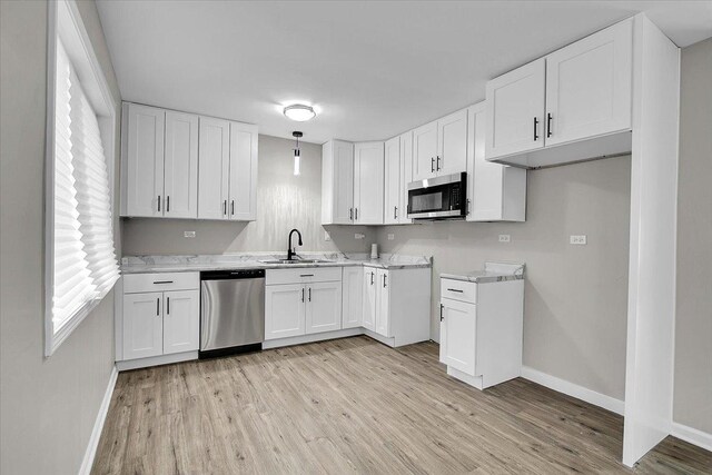 549 Allen Ln, University Park, IL 60484 - kitchen with stainless steel appliances, light wood-style floors, white cabinets, and light countertops