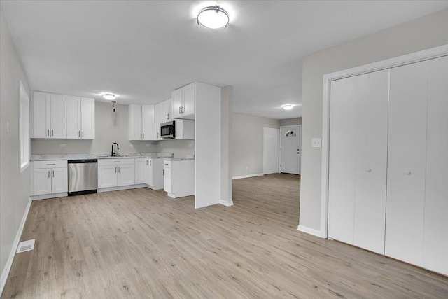 549 Allen Ln, University Park, IL 60484 - kitchen with appliances with stainless steel finishes, light wood-type flooring, white cabinetry, and light countertops