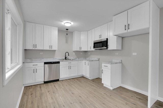 549 Allen Ln, University Park, IL 60484 - kitchen featuring appliances with stainless steel finishes, light wood-style flooring, and white cabinetry