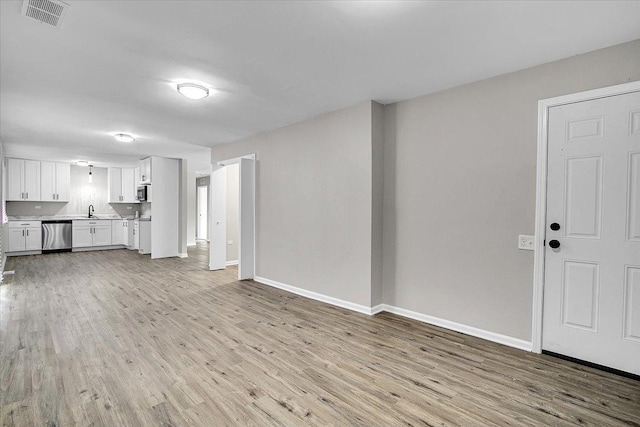 549 Allen Ln, University Park, IL 60484 - unfurnished living room featuring light wood-style floors and a sink