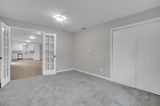 549 Allen Ln, University Park, IL 60484 - unfurnished bedroom with french doors, light carpet, and a closet