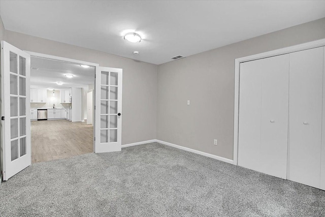 549 Allen Ln, University Park, IL 60484 - unfurnished bedroom with french doors, carpet, and a closet