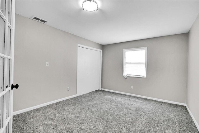 549 Allen Ln, University Park, IL 60484 - unfurnished bedroom with carpet floors and a closet