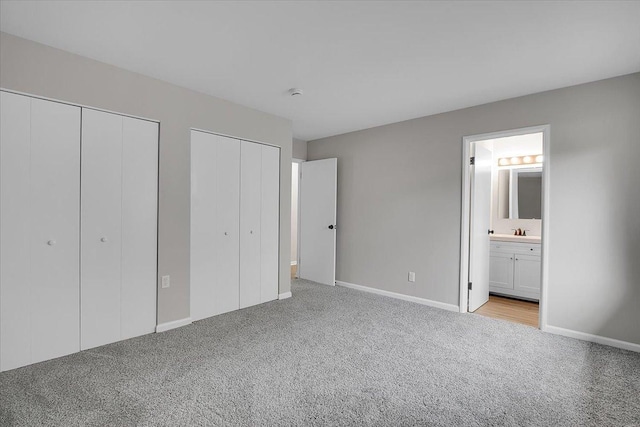 549 Allen Ln, University Park, IL 60484 - unfurnished bedroom with two closets, light colored carpet, and connected bathroom