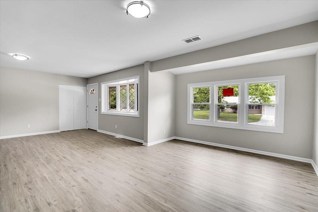 549 Allen Ln, University Park, IL 60484 - unfurnished living room with wood finished floors and baseboards