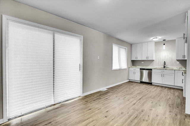 549 Allen Ln, University Park, IL 60484 - kitchen with dishwasher, light wood-style floors, light countertops, and white cabinetry