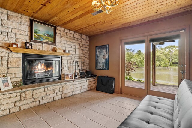 20340 Rt 113th Hwy, Wilmington, IL 60481 - living room with tile patterned floors, wood ceiling, a chandelier, and a stone fireplace