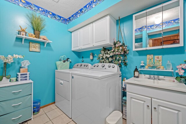 20340 Rt 113th Hwy, Wilmington, IL 60481 - laundry room with washer and clothes dryer, a textured ceiling, cabinet space, and light tile patterned floors
