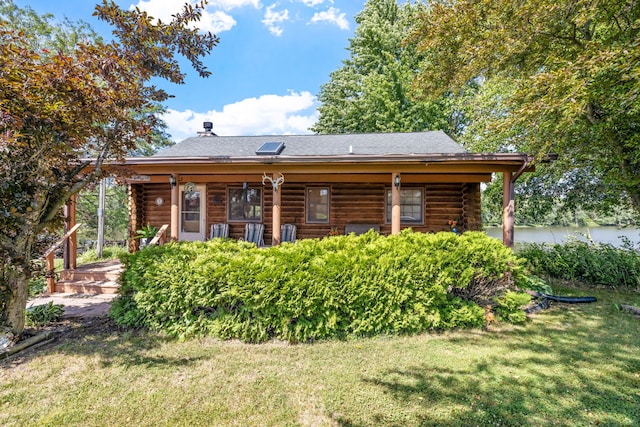 20340 Rt 113th Hwy, Wilmington, IL 60481 - back of property featuring log siding, a lawn, covered porch, and roof with shingles