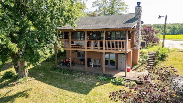 20340 Rt 113th Hwy, Wilmington, IL 60481 - back of house featuring a wooden deck, a yard, a chimney, and stairs
