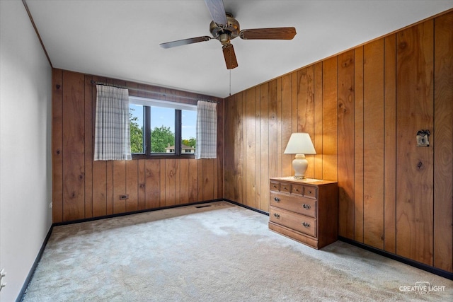 6841 Carpenter St, Downers Grove, IL 60516 - spare room featuring a ceiling fan, light colored carpet, and wood walls