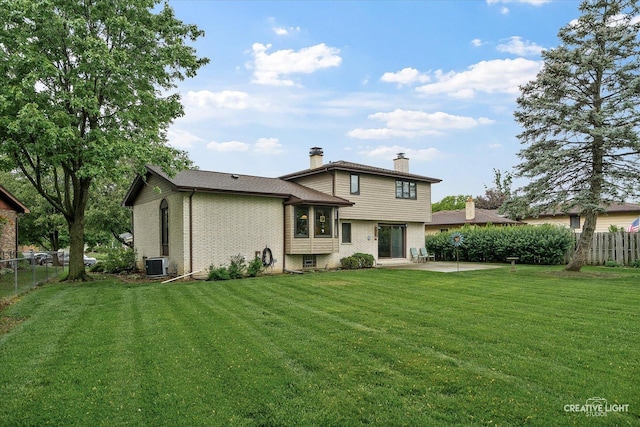 6841 Carpenter St, Downers Grove, IL 60516 - back of property featuring a chimney, brick siding, and a patio