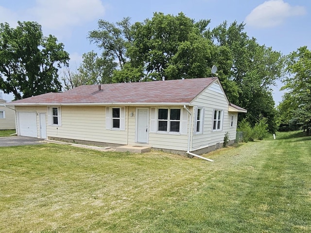 3959 Riverside Blvd, Rockford, IL 61101 - view of front of property with driveway, a front yard, and a garage