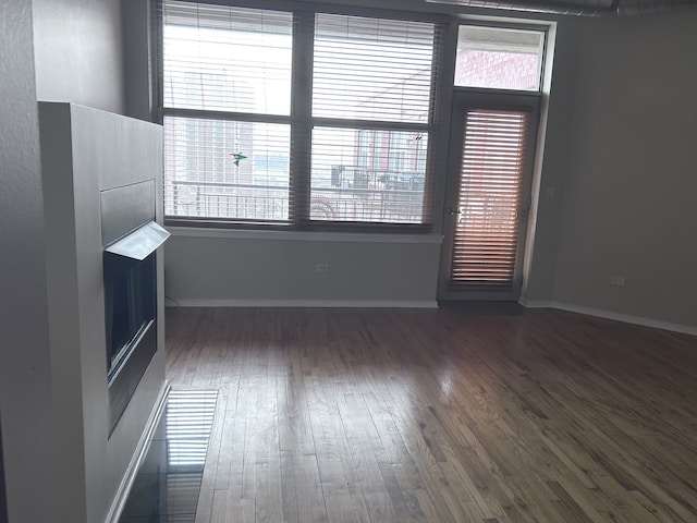 6 S Laflin St Unit 920, Chicago, IL 60607 - spare room featuring dark wood finished floors and plenty of natural light