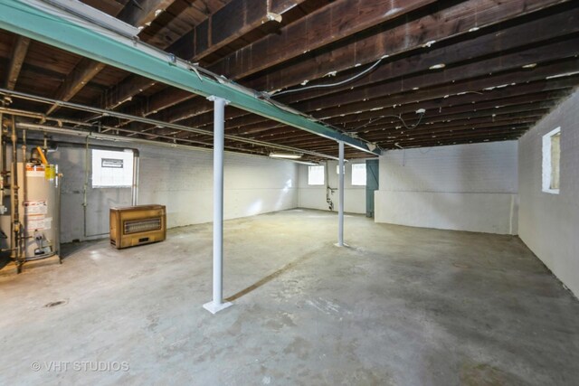 5404 W Henderson St, Chicago, IL 60641 - below grade area featuring gas water heater and plenty of natural light