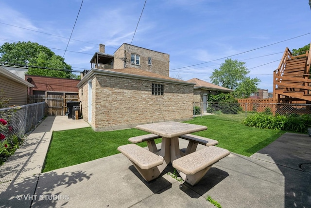 5404 W Henderson St, Chicago, IL 60641 - fenced backyard featuring a patio and outdoor dining space