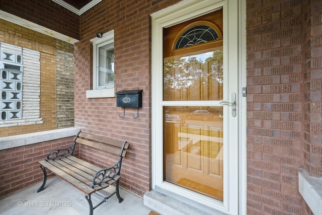 5404 W Henderson St, Chicago, IL 60641 - doorway to property with a porch and brick siding