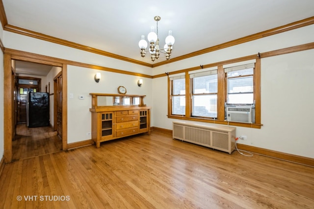 5404 W Henderson St, Chicago, IL 60641 - spare room featuring radiator heating unit, a chandelier, wood finished floors, ornamental molding, and cooling unit