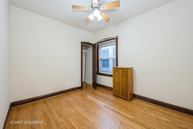 5404 W Henderson St, Chicago, IL 60641 - spare room featuring light wood-style flooring and ceiling fan