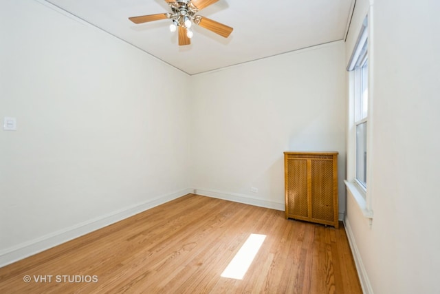5404 W Henderson St, Chicago, IL 60641 - unfurnished room featuring light wood-style flooring and ceiling fan