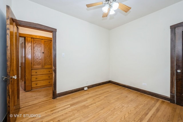 5404 W Henderson St, Chicago, IL 60641 - spare room with light wood-type flooring and a ceiling fan