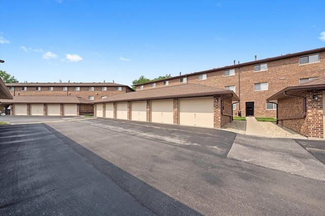 7515 Sheridan Dr Unit 1D, Willowbrook, IL 60527 - view of front of home featuring community garages and brick siding