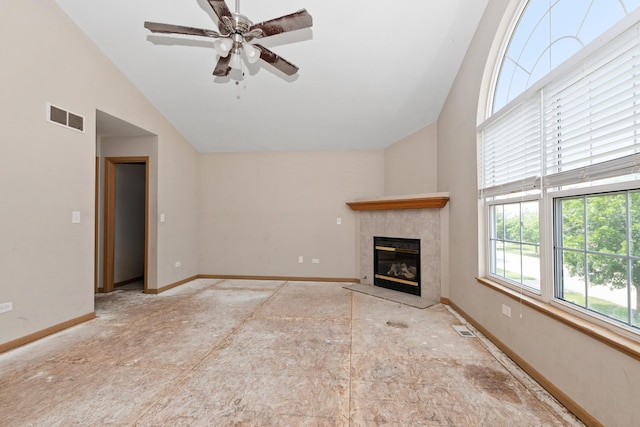 25813 S Geranium Ln, Monee, IL 60449 - unfurnished living room with high vaulted ceiling, a tiled fireplace, and a ceiling fan