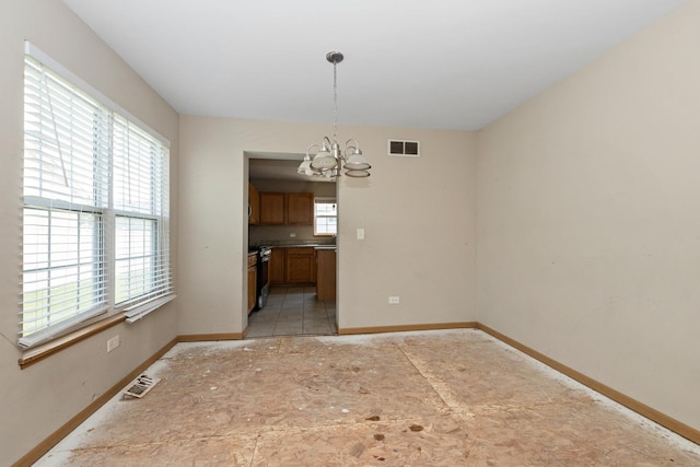 25813 S Geranium Ln, Monee, IL 60449 - unfurnished dining area featuring a chandelier and baseboards