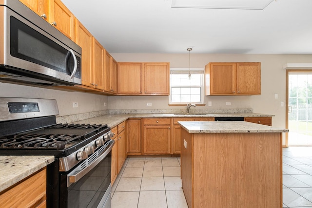 25813 S Geranium Ln, Monee, IL 60449 - kitchen with appliances with stainless steel finishes, light tile patterned floors, a center island, pendant lighting, and light stone counters