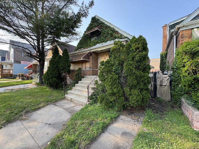 8371 S Baltimore Ave, Chicago, IL 60617 - view of front of home featuring a front yard and brick siding