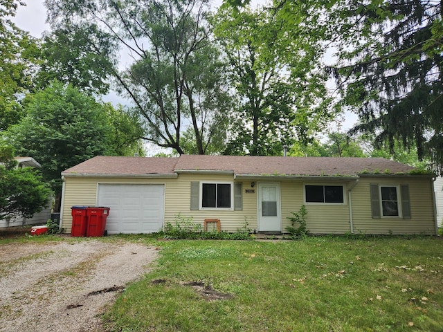 1306 Westfield Dr, Champaign, IL 61821 - ranch-style house featuring an attached garage, driveway, and a front yard