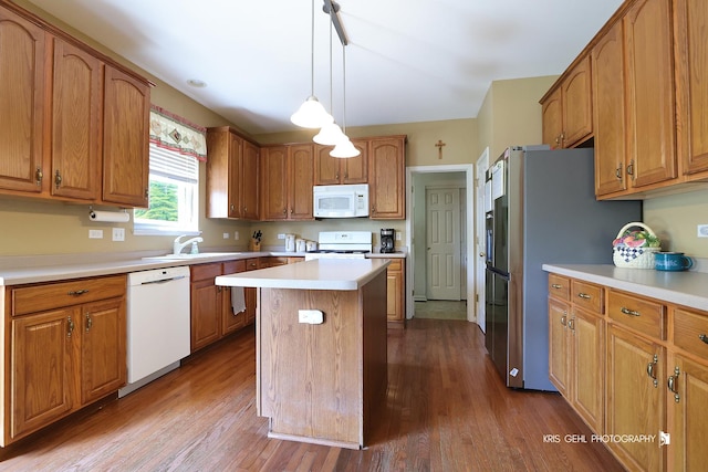 2467 W Autumn Dr, Round Lake, IL 60073 - kitchen featuring white appliances, a kitchen island, dark wood-type flooring, and brown cabinets