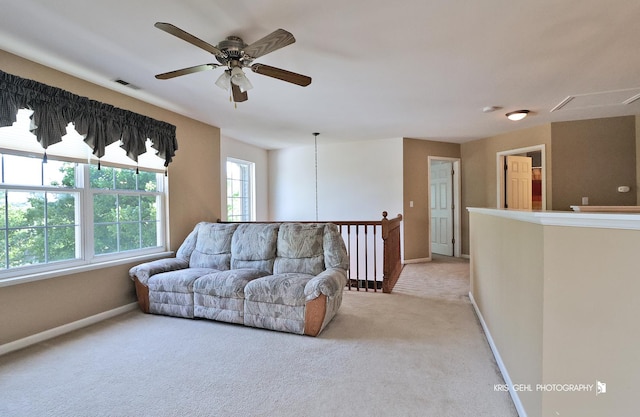 2467 W Autumn Dr, Round Lake, IL 60073 - living room featuring light carpet, ceiling fan, and attic access