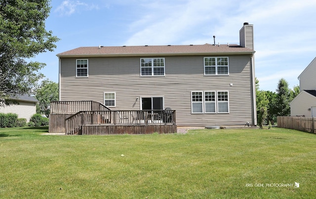 2467 W Autumn Dr, Round Lake, IL 60073 - back of property featuring a deck, a yard, and a chimney