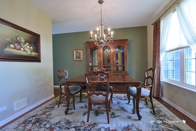 2467 W Autumn Dr, Round Lake, IL 60073 - dining room featuring a chandelier and wood finished floors