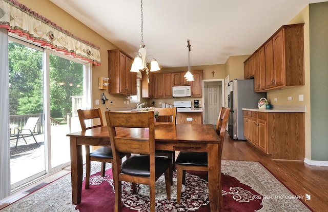 2467 W Autumn Dr, Round Lake, IL 60073 - dining area with dark wood-style flooring and baseboards