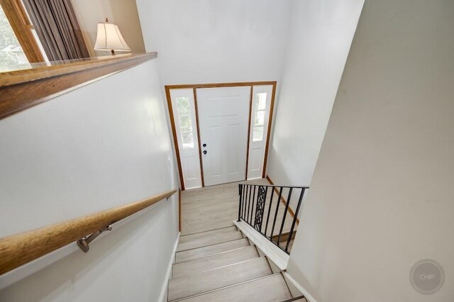 24460 Easy St, Plainfield, IL 60586 - stairway featuring healthy amount of natural light and wood finished floors