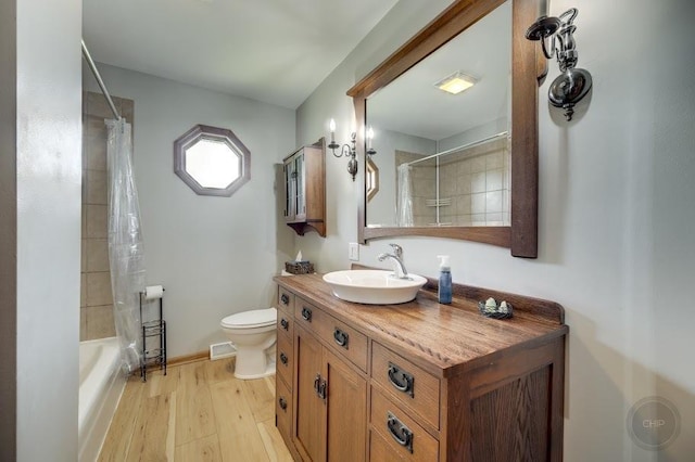 24460 Easy St, Plainfield, IL 60586 - full bathroom featuring vanity, wood finished floors, and shower / bath combo