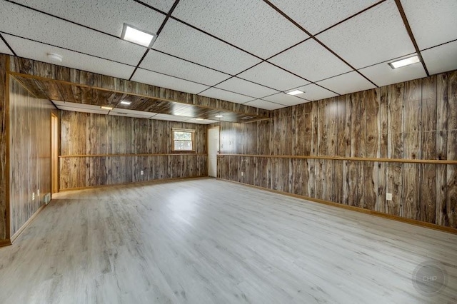24460 Easy St, Plainfield, IL 60586 - below grade area featuring wood walls, wood finished floors, and a paneled ceiling