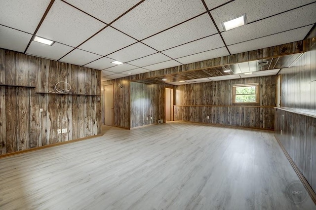 24460 Easy St, Plainfield, IL 60586 - below grade area with wood walls, a paneled ceiling, and wood finished floors