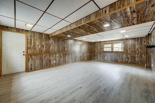 24460 Easy St, Plainfield, IL 60586 - basement with wooden walls, a drop ceiling, and wood finished floors