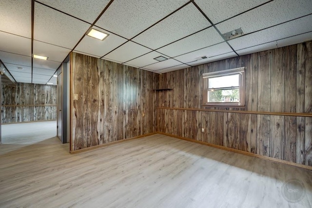 24460 Easy St, Plainfield, IL 60586 - basement featuring a paneled ceiling, wood finished floors, and wooden walls