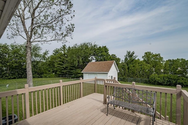 24460 Easy St, Plainfield, IL 60586 - deck featuring a garage, an outdoor structure, a fenced backyard, and view of wooded area