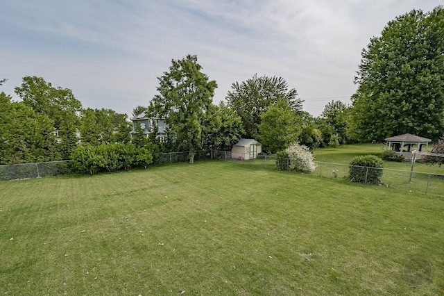 24460 Easy St, Plainfield, IL 60586 - fenced backyard featuring view of scattered trees and a shed