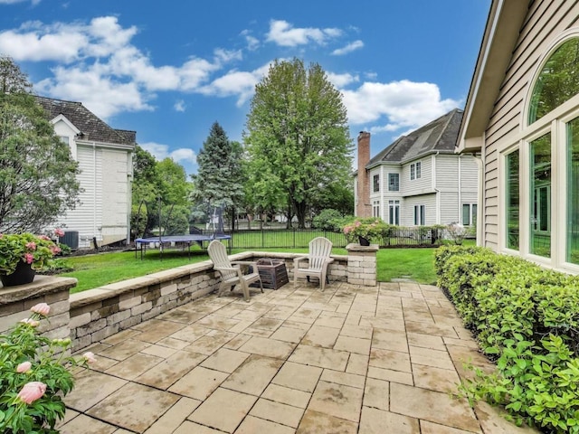 1664 Imperial Cir, Naperville, IL 60563 - view of patio with a trampoline and an outdoor fire pit