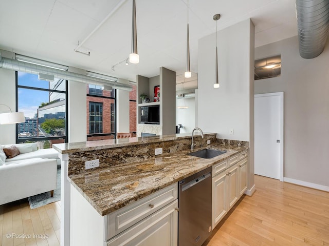 740 W Fulton St Unit 1202, Chicago, IL 60661 - kitchen with dishwasher, open floor plan, light wood-type flooring, and stone counters