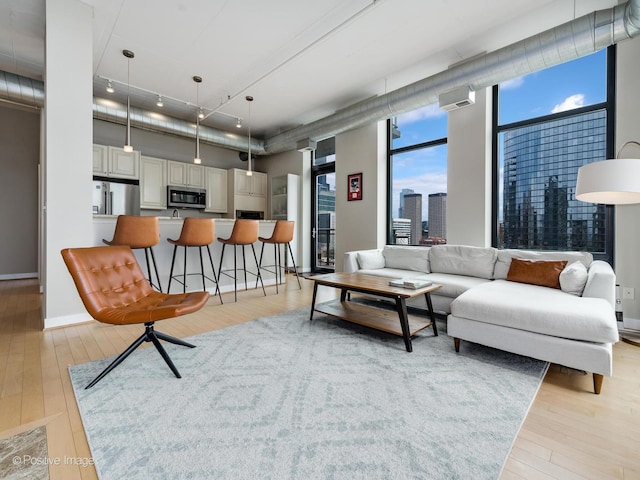 740 W Fulton St Unit 1202, Chicago, IL 60661 - living area with light wood-style flooring, a view of city, and wine cooler