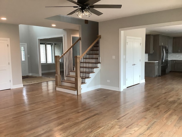 12415 Foxborough Dr, Mokena, IL 60448 - unfurnished living room featuring stairs, a ceiling fan, wood finished floors, and recessed lighting