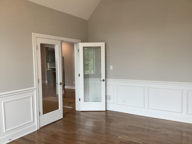 12415 Foxborough Dr, Mokena, IL 60448 - spare room with lofted ceiling, french doors, wainscoting, dark wood-type flooring, and a decorative wall