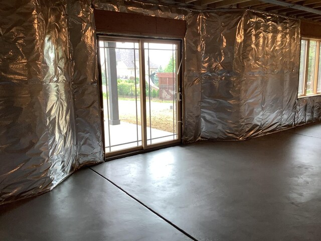 12415 Foxborough Dr, Mokena, IL 60448 - empty room featuring finished concrete flooring and plenty of natural light